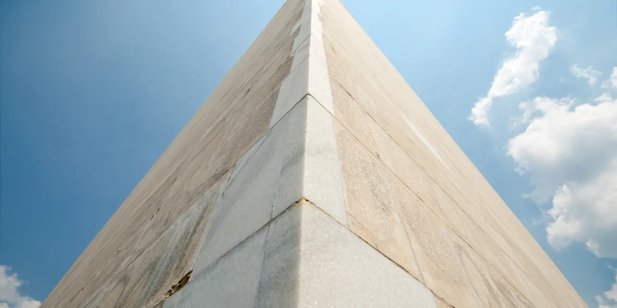 Close-up view of a building corner with clean, smooth walls.