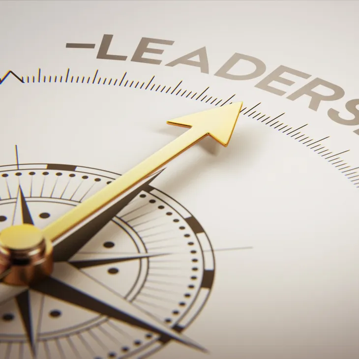 Compass needle pointing to 'Leadership' symbolizing direction.
